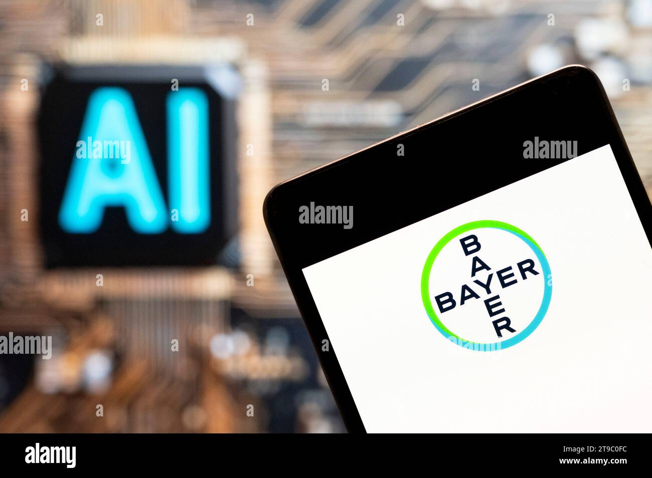 November 3, 2023, China: In this photo illustration, the German multinational pharmaceutical company, the Bayer AG (ETR: BAYN) logo seen displayed on a smartphone with an Artificial intelligence (AI) chip and symbol in the background. (Credit Image: © Budrul Chukrut/SOPA Images via ZUMA Press Wire) EDITORIAL USAGE ONLY! Not for Commercial USAGE! Stock Photo