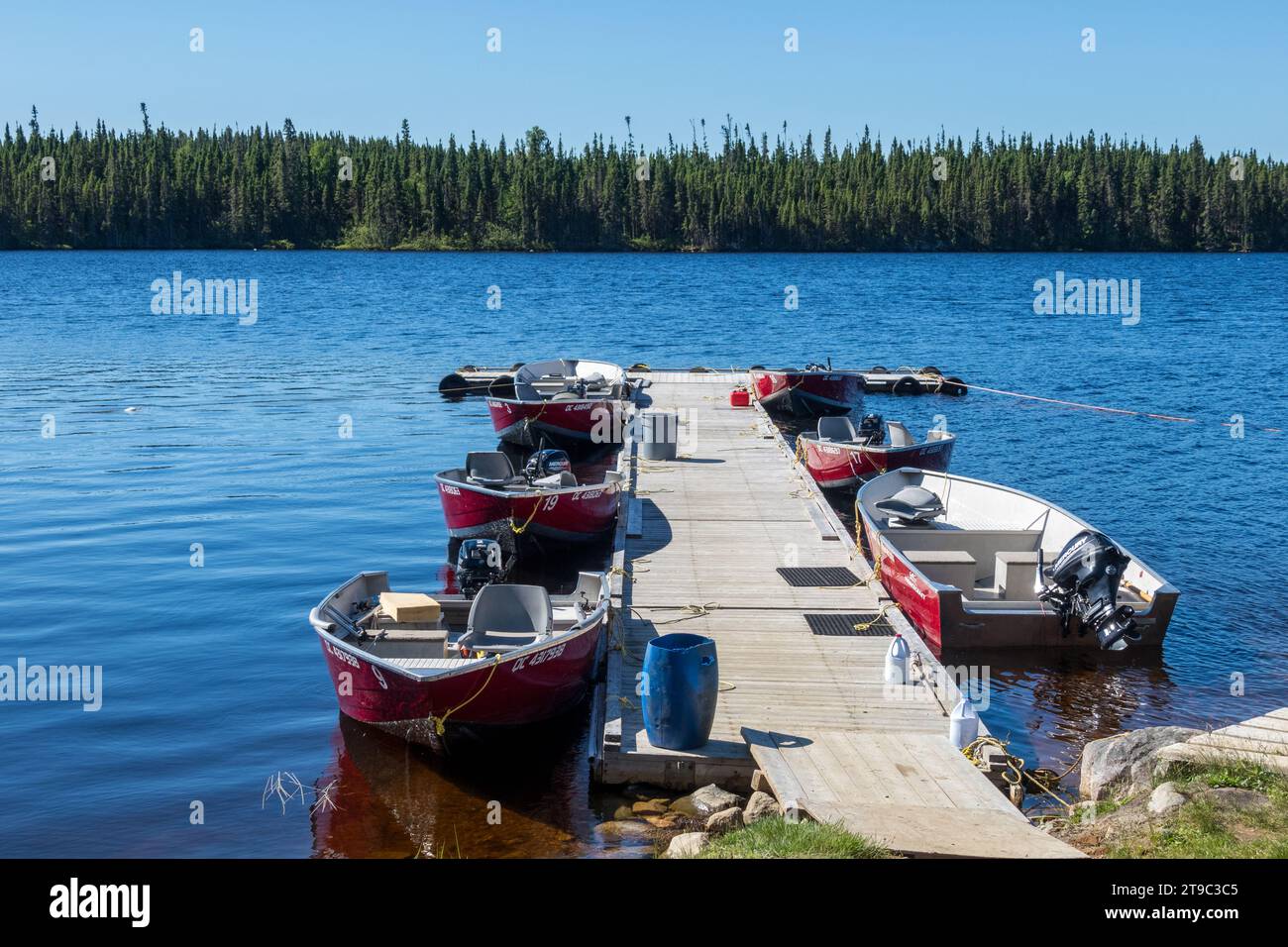 Fishing boats moored at the dock of the Lac du Male outfitter, province of Quebec, Canada Stock Photo
