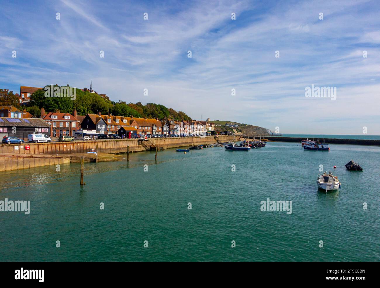 Boats moored in the harbour in Folkestone Kent UK a port town on the English Channel in south east England with blue sky above. Stock Photo