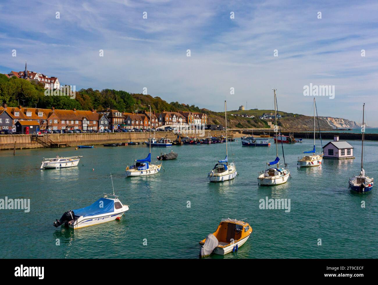 Boats moored in the harbour in Folkestone Kent UK a port town on the English Channel in south east England with blue sky above. Stock Photo