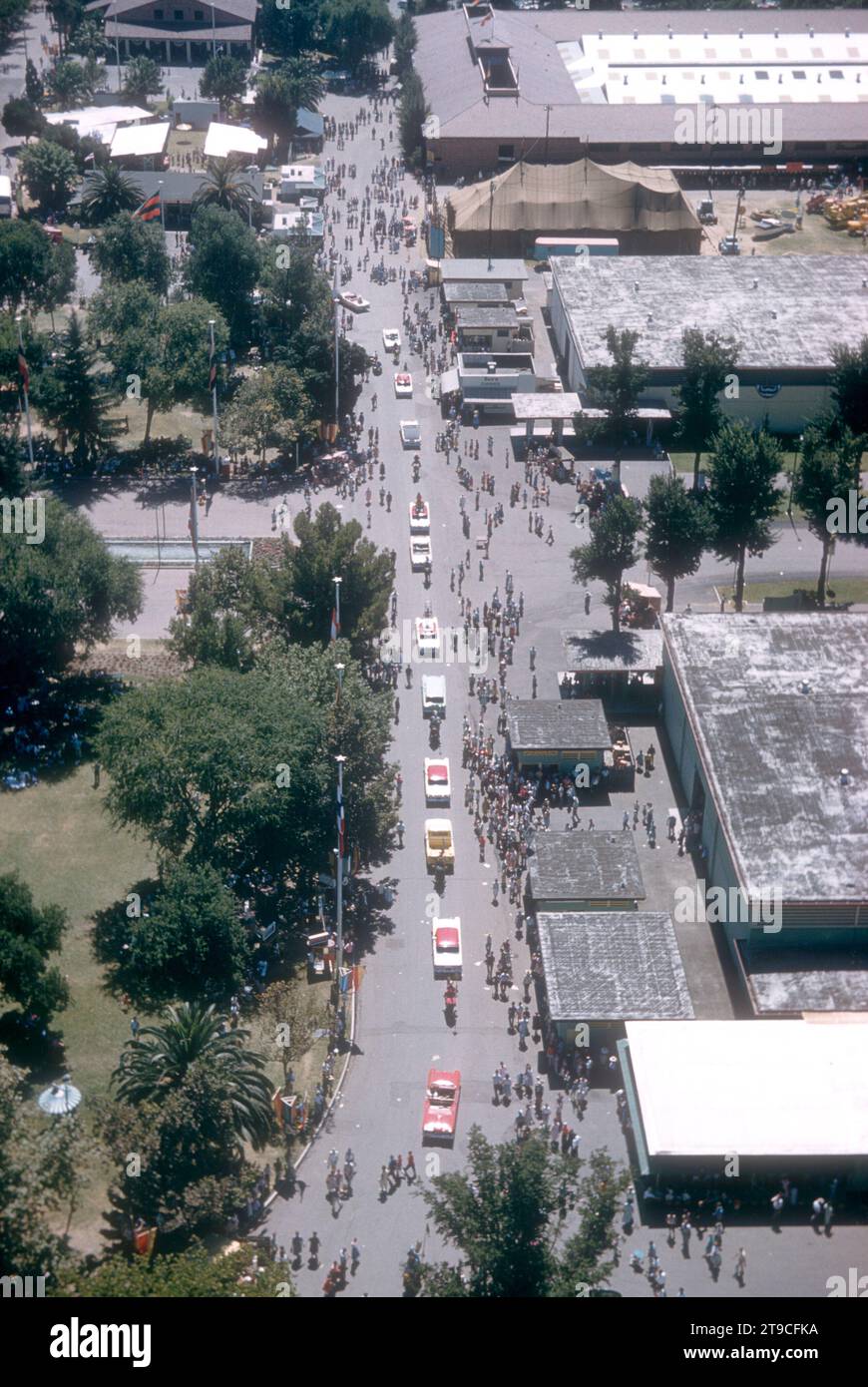 SACRAMENTO, CA - AUGUST, 1958: An aerial view of the Sacramento State Fairgrounds as a parade of cars rolls down street circa August, 1958 in Sacramento, California. (Photo by Hy Peskin/Getty Images) (Set Number: X5347) Stock Photo