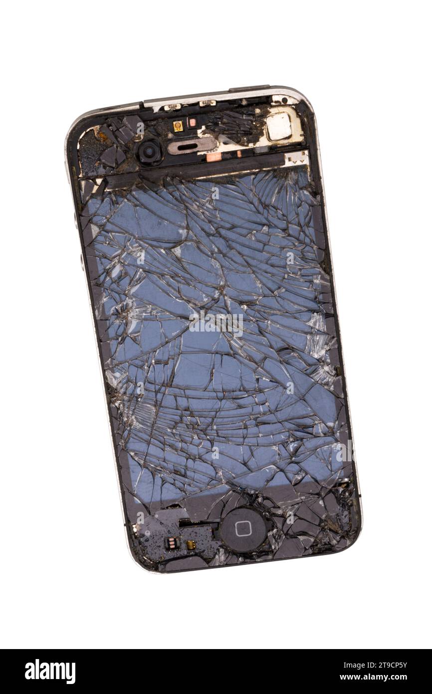 Smashed and destroyed iphone Apple mobile telephone / smart device telephone / phone with a broken and cracked screen. (136) Stock Photo