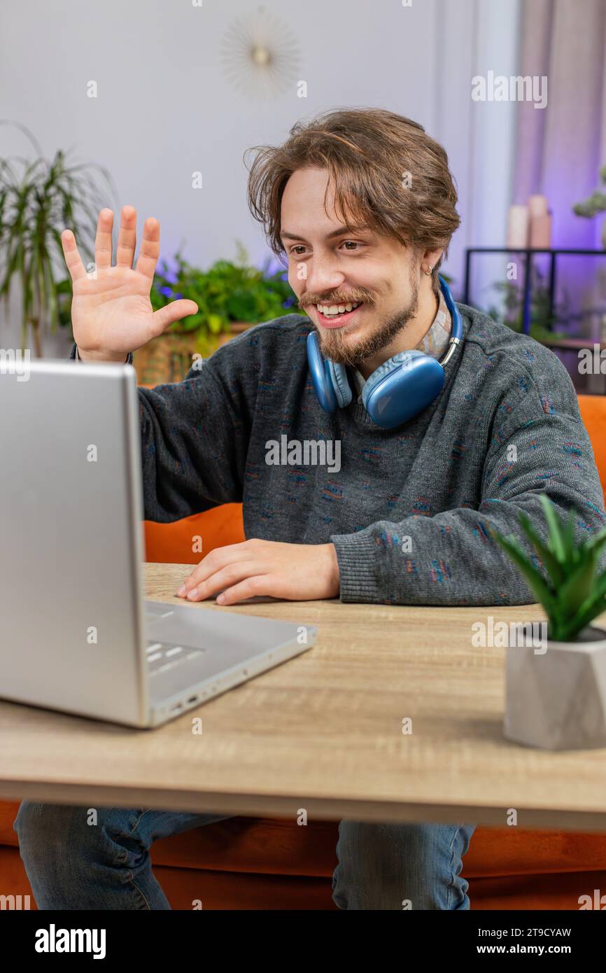 Hello Looking In Man waving hello vertical video hi-res stock photography and images - Alamy