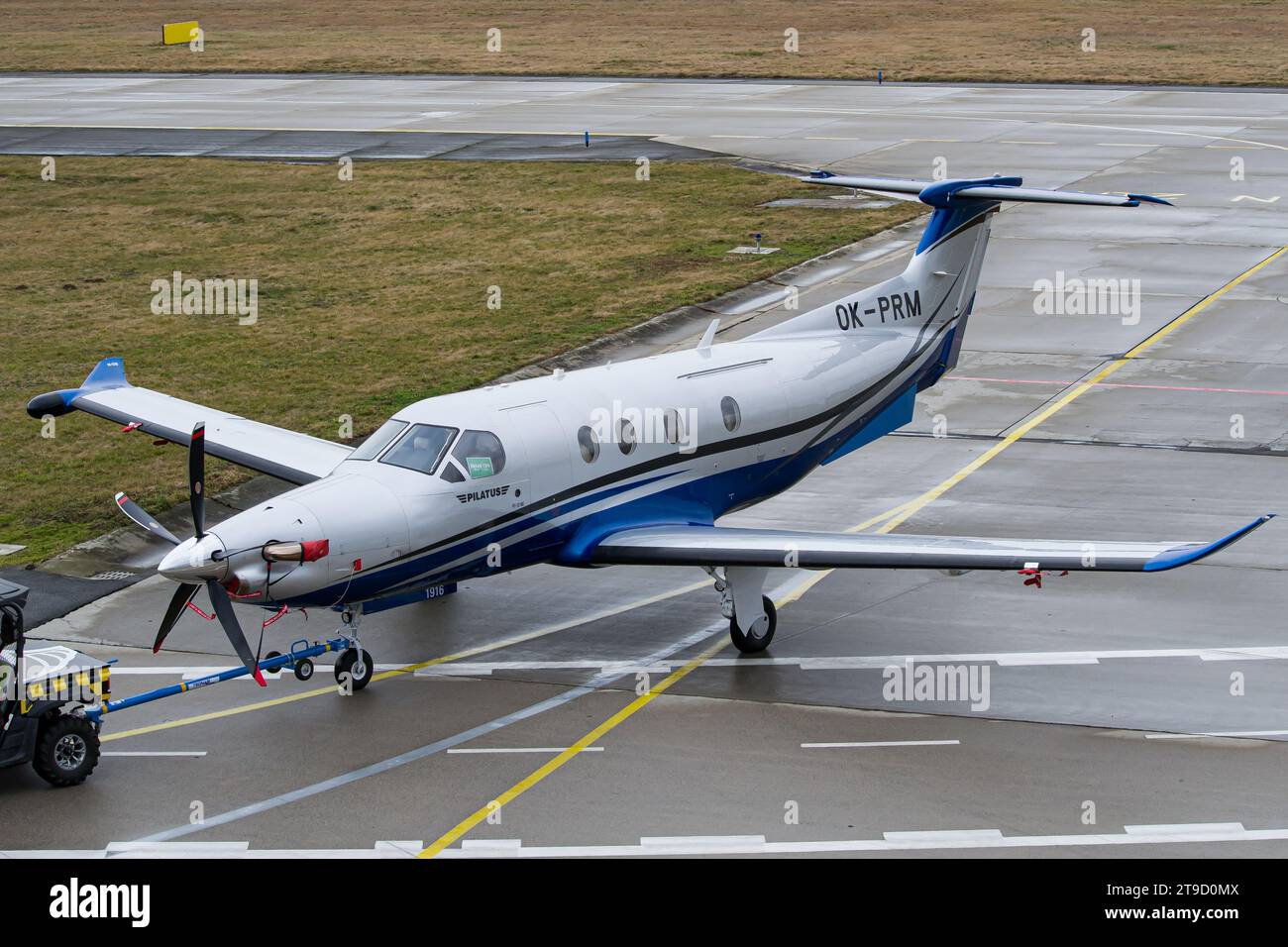 Pilatus PC-12 being tugged to the hangar after arriving to Ostrava Stock Photo