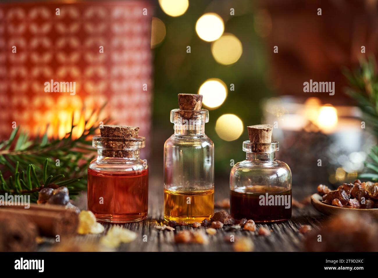 Christmas selection of essential oils with myrrh, frankincense, spruce and cinnamon Stock Photo