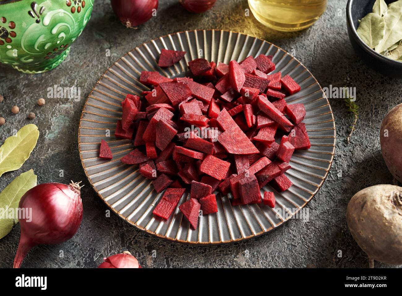 Pieces of red beet on a black plate preparation of fermented beet