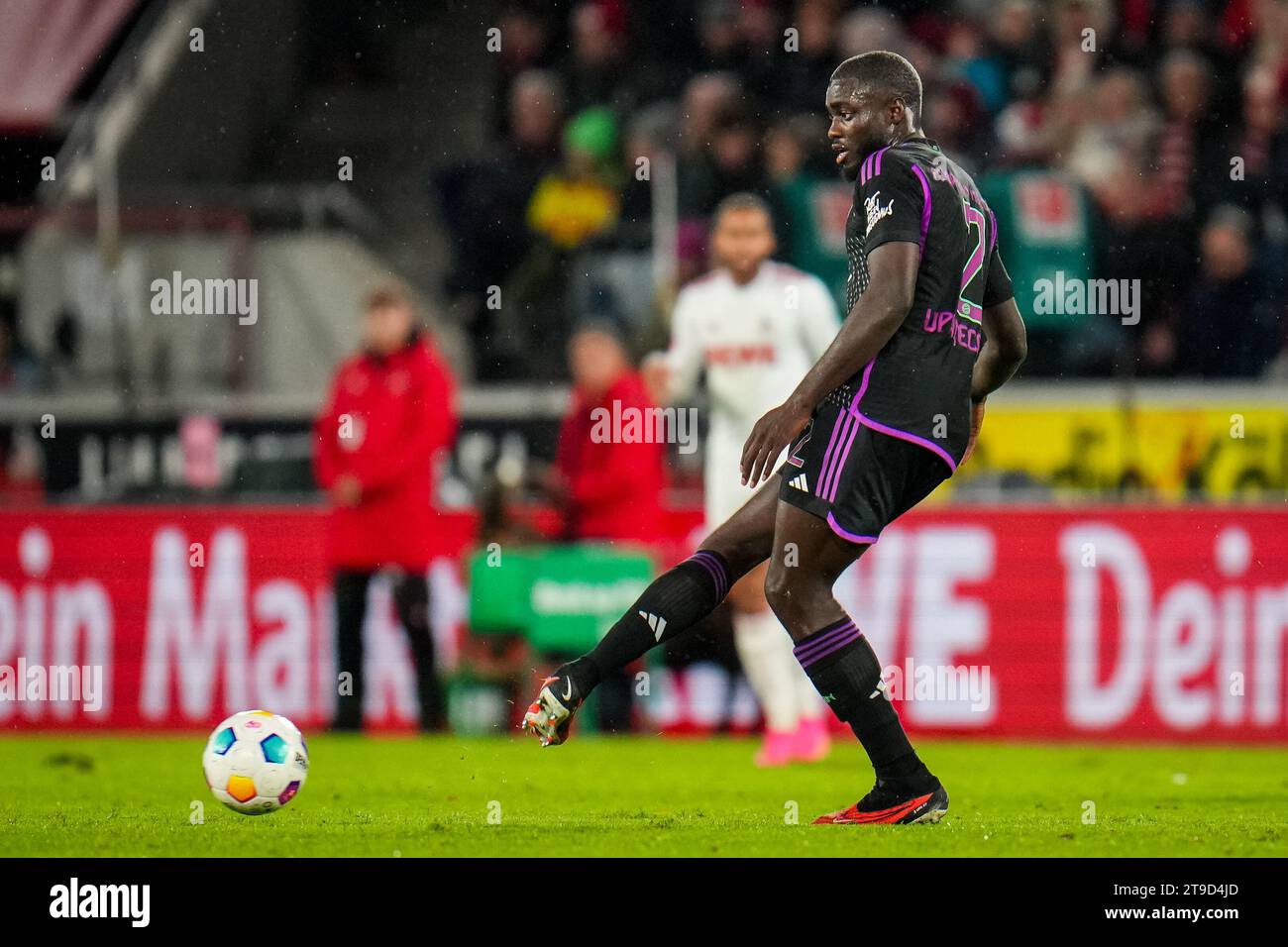 Cologne, Germany. 24th Nov, 2023. COLOGNE, GERMANY - NOVEMBER 24: Dayot Upamecano of FC Bayern Munchen passes the ball during the Bundesliga match between 1. FC Koln and FC Bayern Munchen at the RheinEnergieStadion on November 24, 2023 in Cologne, Germany. (Photo by Rene Nijhuis/BSR Agency) Credit: BSR Agency/Alamy Live News Stock Photo