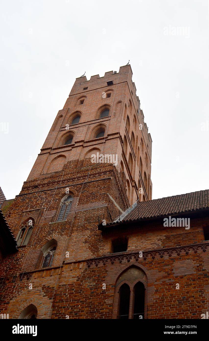 MALBORK, POLAND - 6 NOVEMBER 2023: A tower of the world's largest castle, once the seat of the grand masterle of the Teutonic Order originally built i Stock Photo