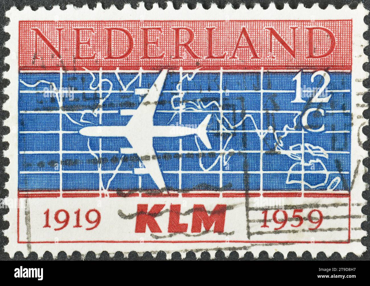 Cancelled postage stamp printed by Netherlands, that shows Silhouette of Douglas DC-8 Airliner and World Map, 40th Anniversary of KLM Stock Photo