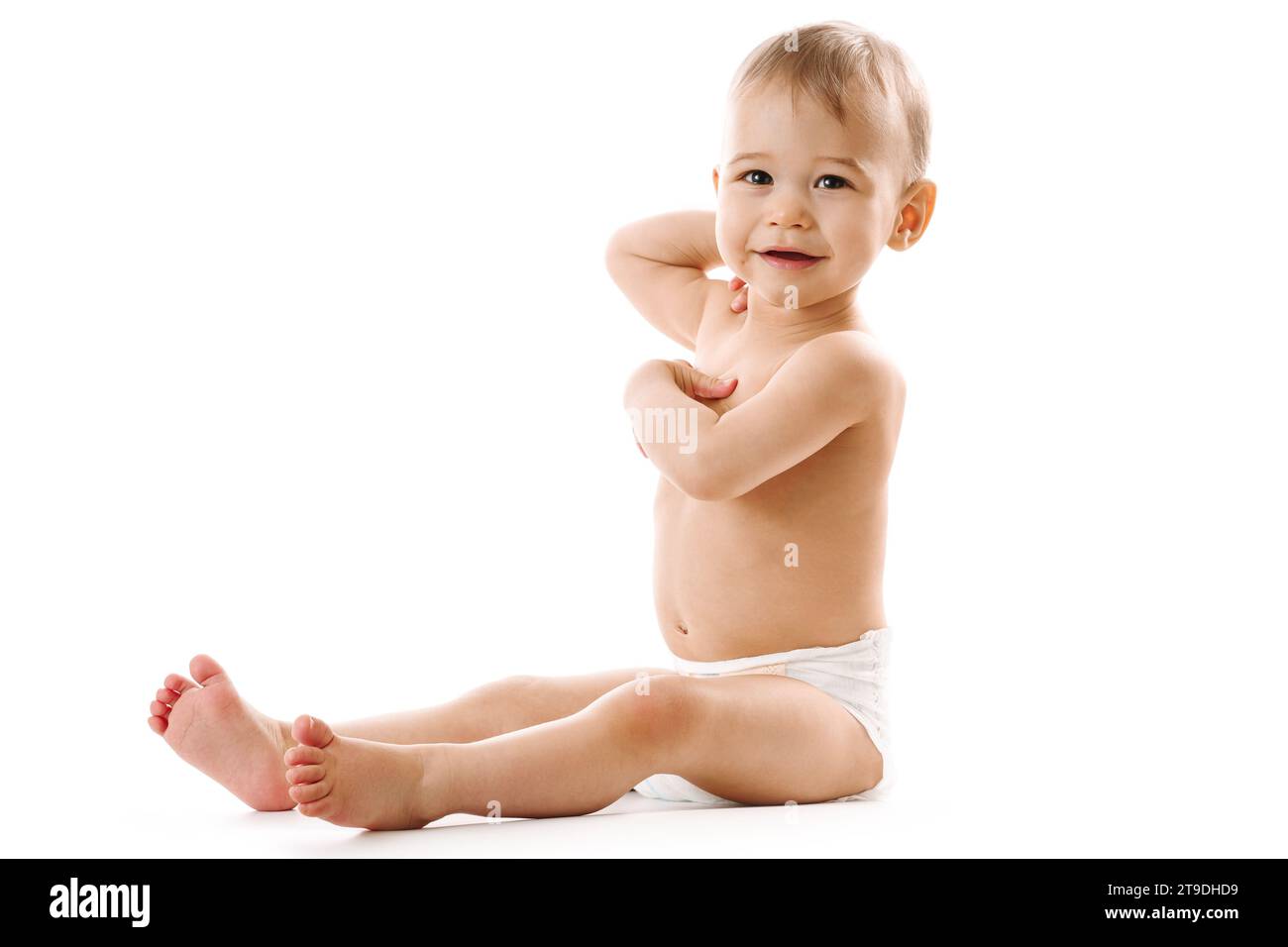 adorable-healthy-little-boy-in-diaper-is-sitting-and-smiling-on-white