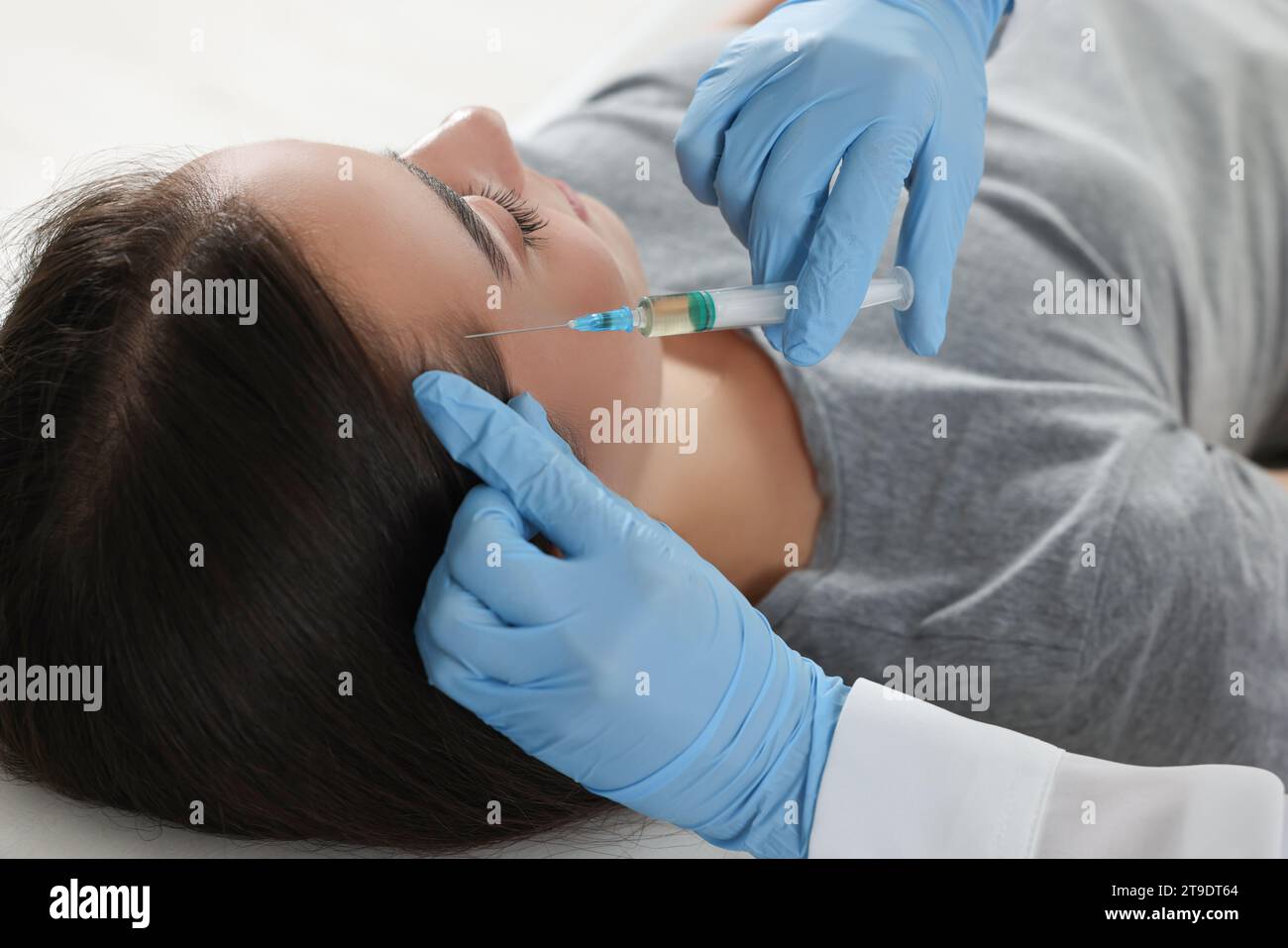Doctor cosmetologist giving injection hi-res stock photography and ...