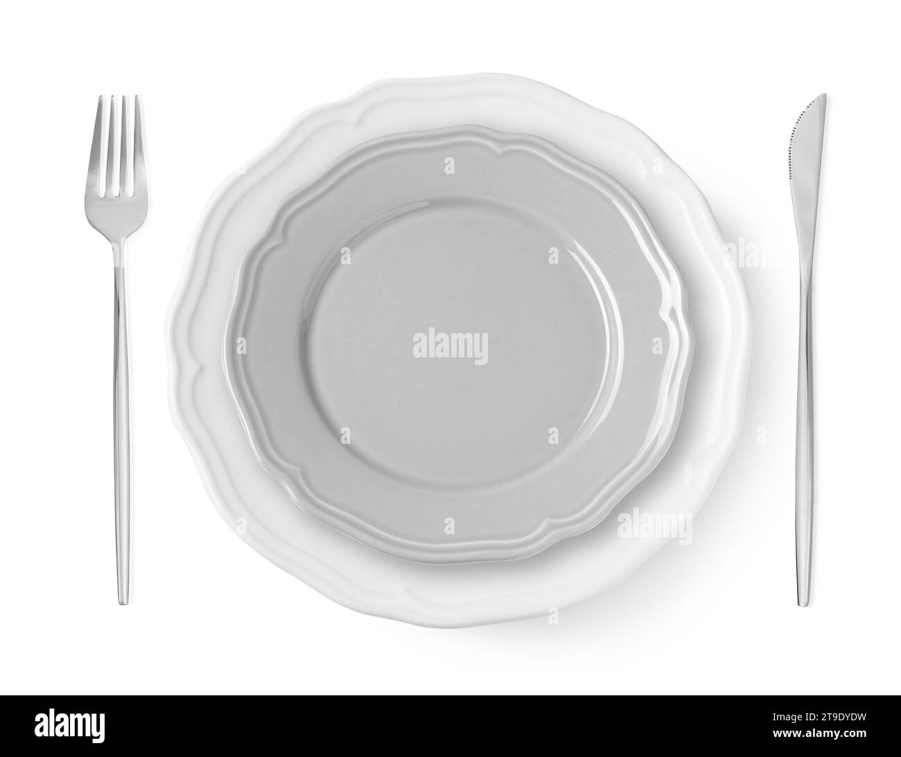 Clean plates, fork and knife on white background, top view Stock Photo ...