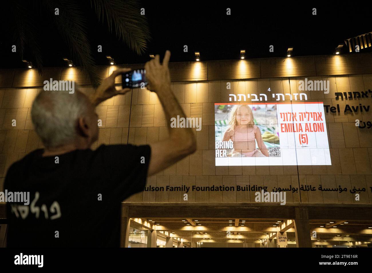 Tel Aviv, Israel. 24th Nov, 2023. A picture of a member of the first group of 13 hostages released from the Gaza Strip is projected on a building in Tel Aviv, Israel, Nov. 24, 2023. Israel's Shin Bet internal security agency has received the first group of 13 hostages released from the Gaza Strip on Friday, local media reported. Credit: Chen Junqing/Xinhua/Alamy Live News Stock Photo
