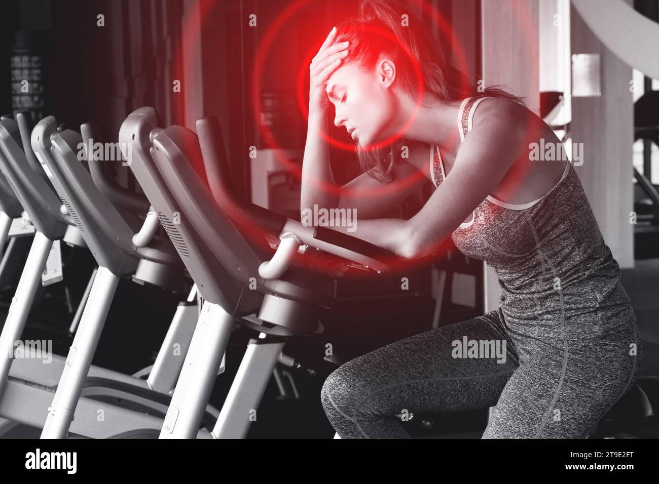 Young woman suffering from painful headache during her fitness workout
