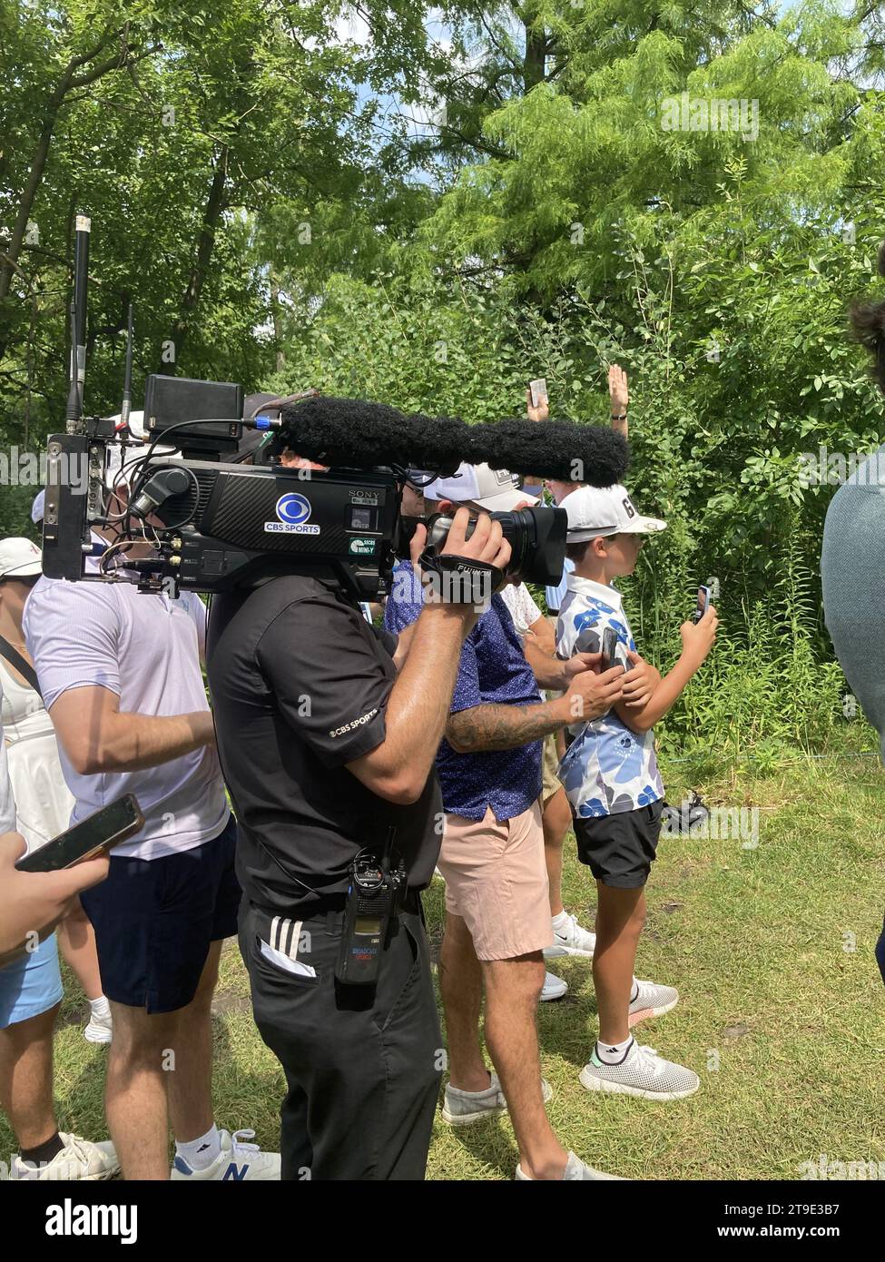 shoulder mounted TV camera at golfing event Stock Photo