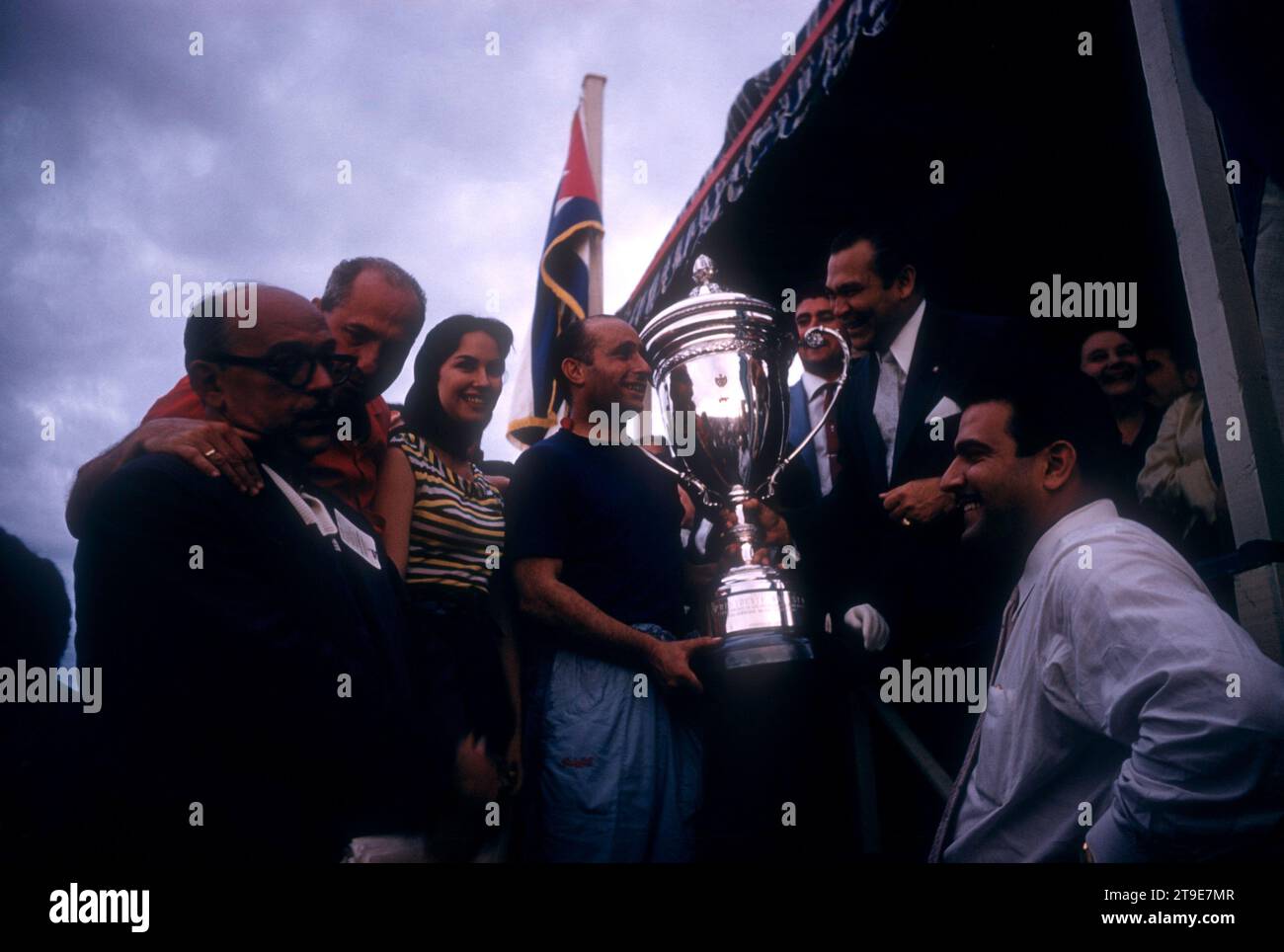 HAVANA, CUBA - FEBRUARY 24:  Juan Manuel Fangio (1911-1995) driver of the Maserati 300S receives the trophy from Cuban dictator Fulgencio Batista (1901-1973) after winning the 1957 Cuban Grand Prix on February 24, 1957 in Havana, Cuba.  (Photo by Hy Peskin) *** Local Caption *** Juan Manuel Fangio;Fulgencio Batista Stock Photo