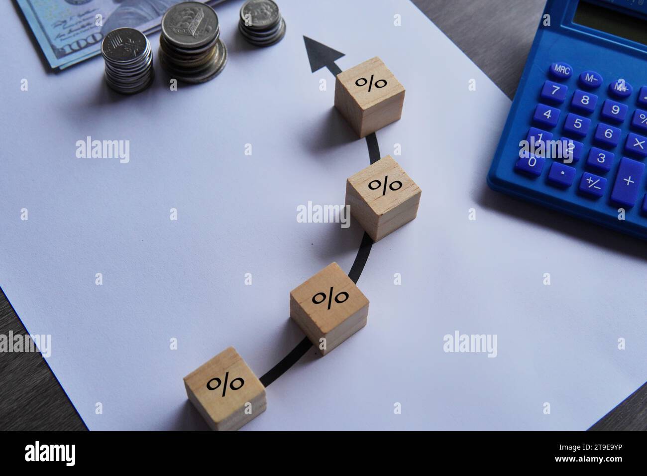 Top view image of money, calculator and increase percentage icon. Finance, interest rate concept. Stock Photo