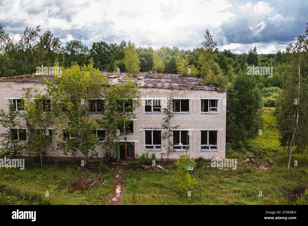 Desolate Building Exterior of an abandoned apartment building with broken windows in a ...