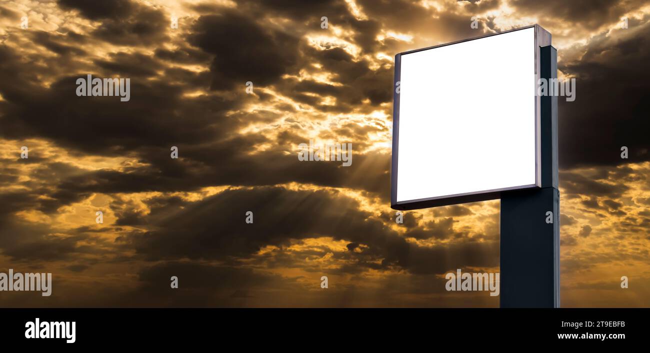 Digital Media blank advertising billboard with sunset sky in background. Blank billboards public commercial with passengers, signboard for product adv Stock Photo