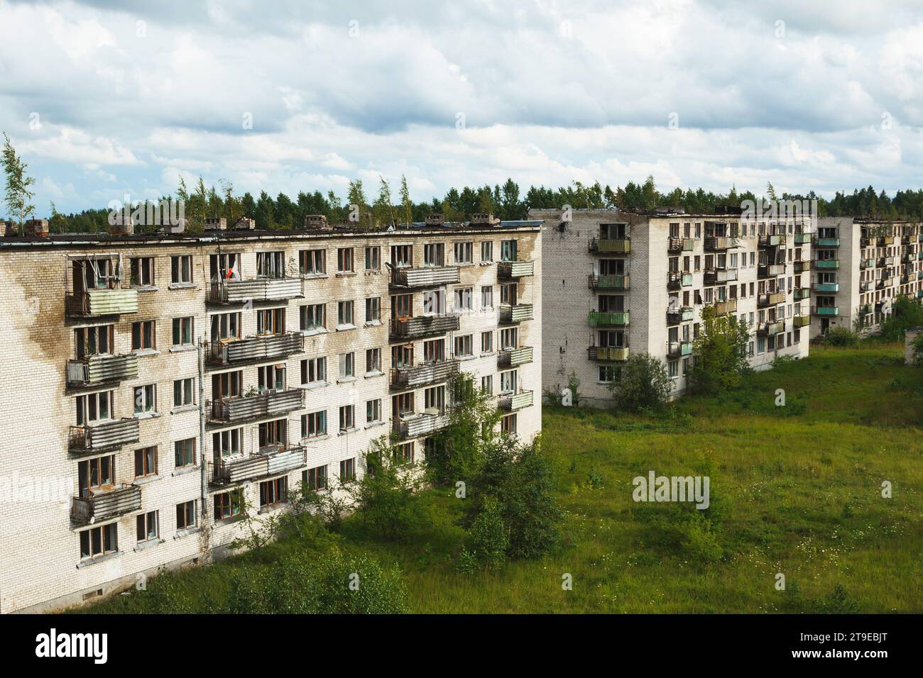 Desolate Building Exterior of an abandoned apartment buildings with broken windows in a ...
