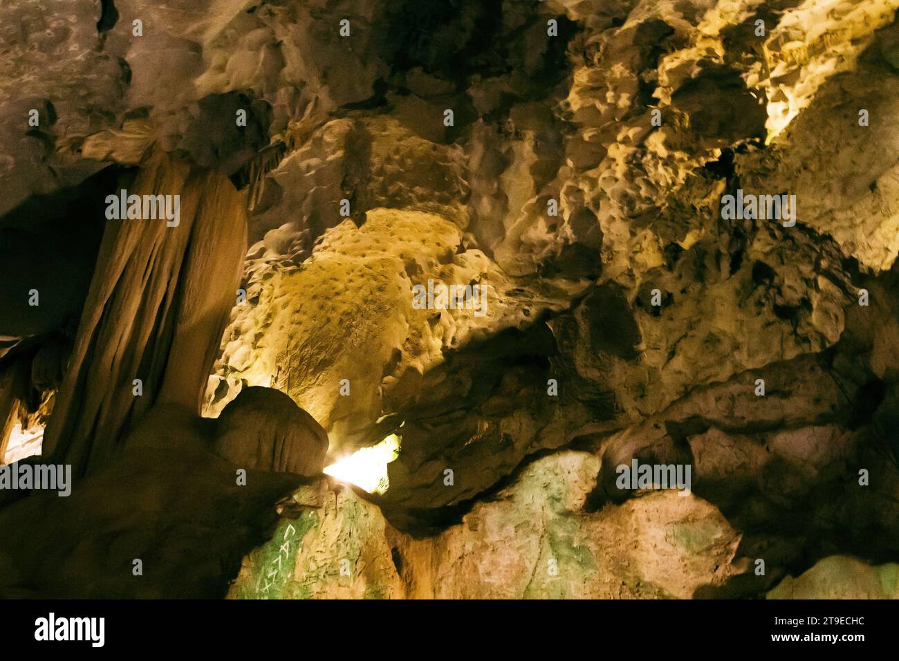 Natural dark and scary underground cave with strangely shaped stone ...