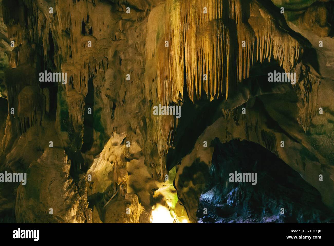 Natural dark and scary underground cave with strangely shaped stone ...