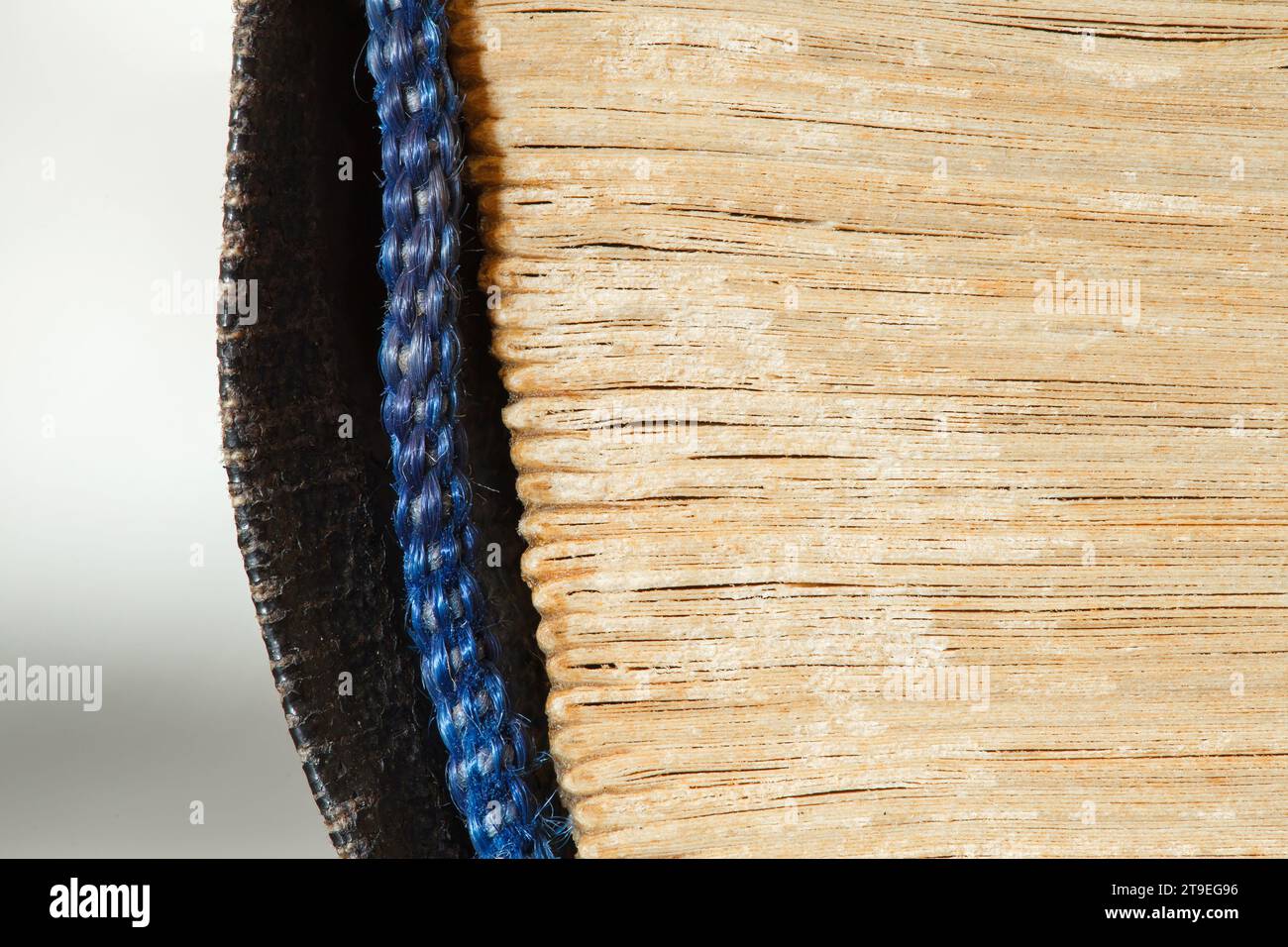 Book old, side is folded sheets, binding is rag close-up macro view Stock Photo