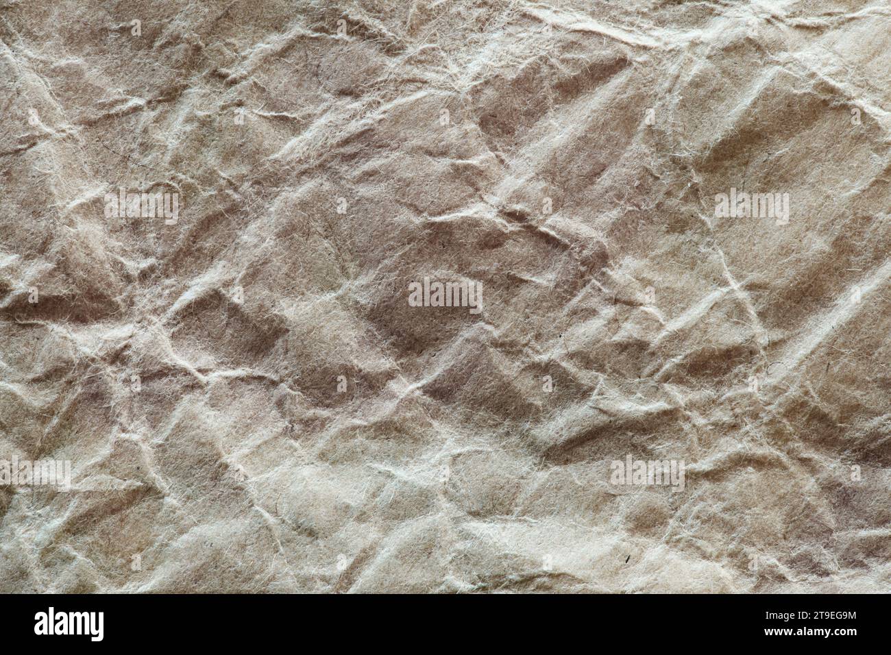 Crumpled craft packaging paper, macro close-up Stock Photo