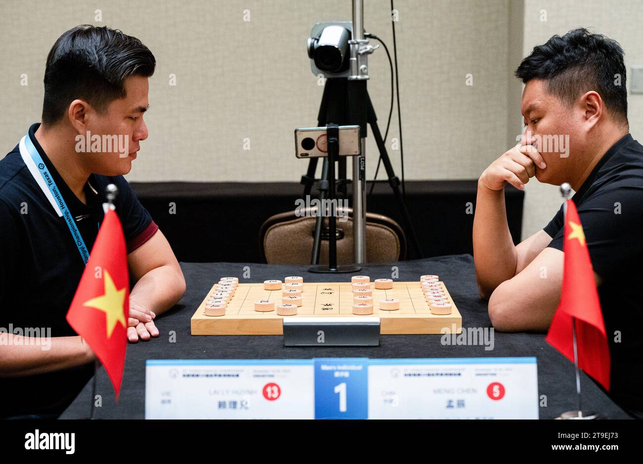 Houston, USA. 24th Nov, 2023. Meng Chen of China (R) competes against Lai Ly Huynh of Vietnam during the men's individual round 9 match at the 18th World Xiangqi Championship in Houston, Texas, the United States, on Nov. 24, 2023. Credit: Chen Chen/Xinhua/Alamy Live News Stock Photo