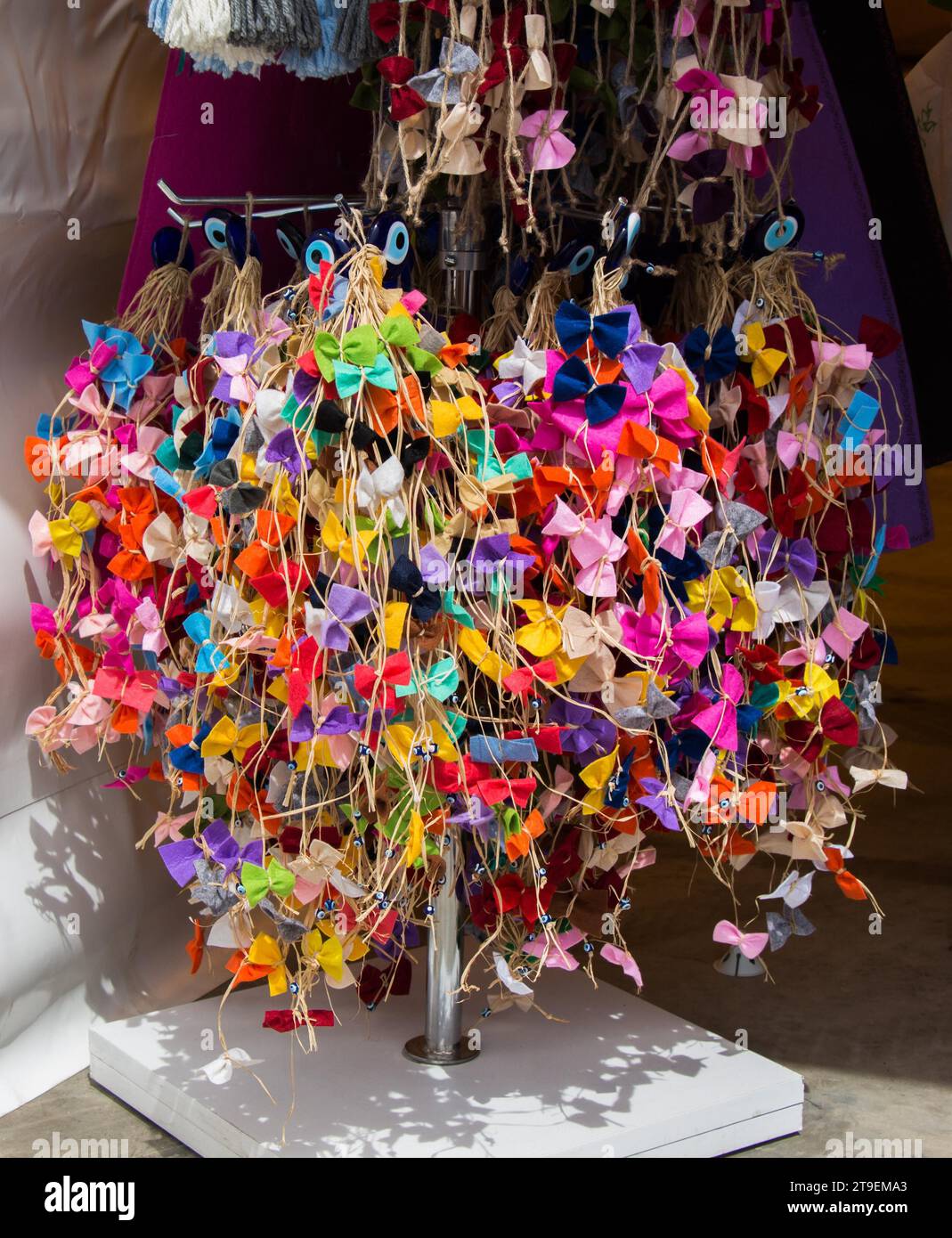 Collection of colored bows and ribbons on threads Stock Photo - Alamy