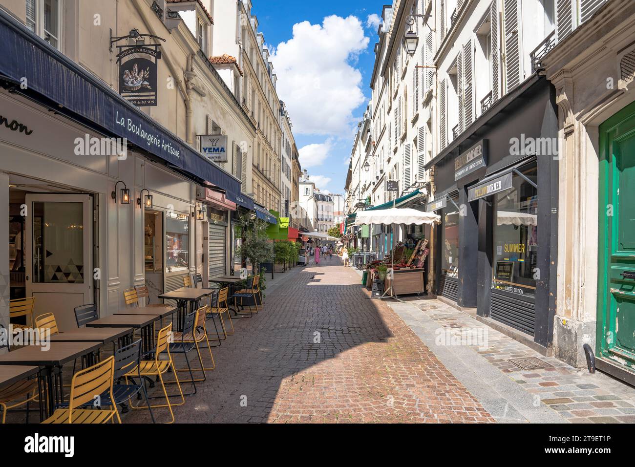 A pedestrian section of Rue de l'Annonciation with shops and stalls, in the Passy neighborhood, 16th arrondissement, Paris, France. Stock Photo