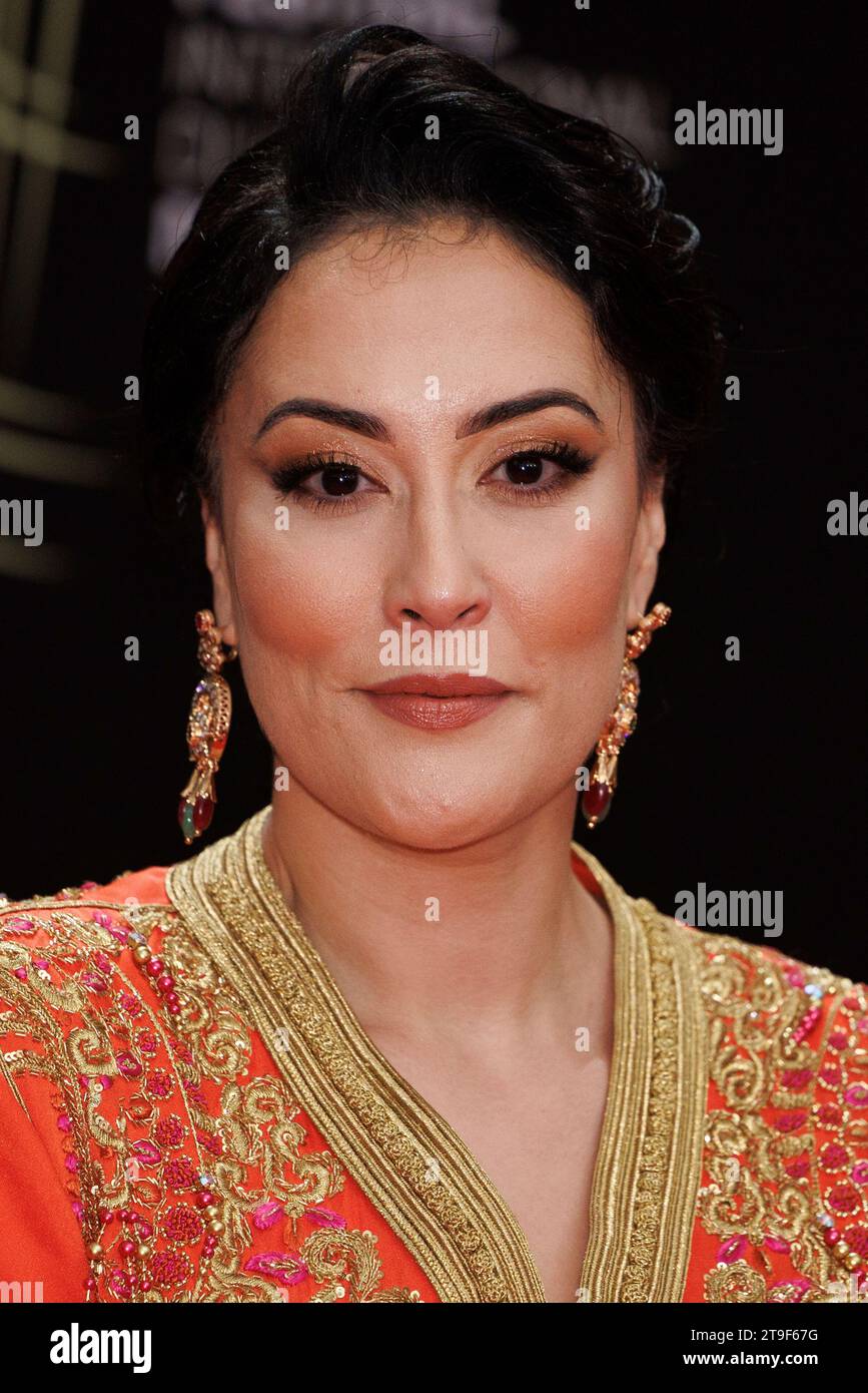 Fatema Zahra Jaouhari poses for photographers before the opening