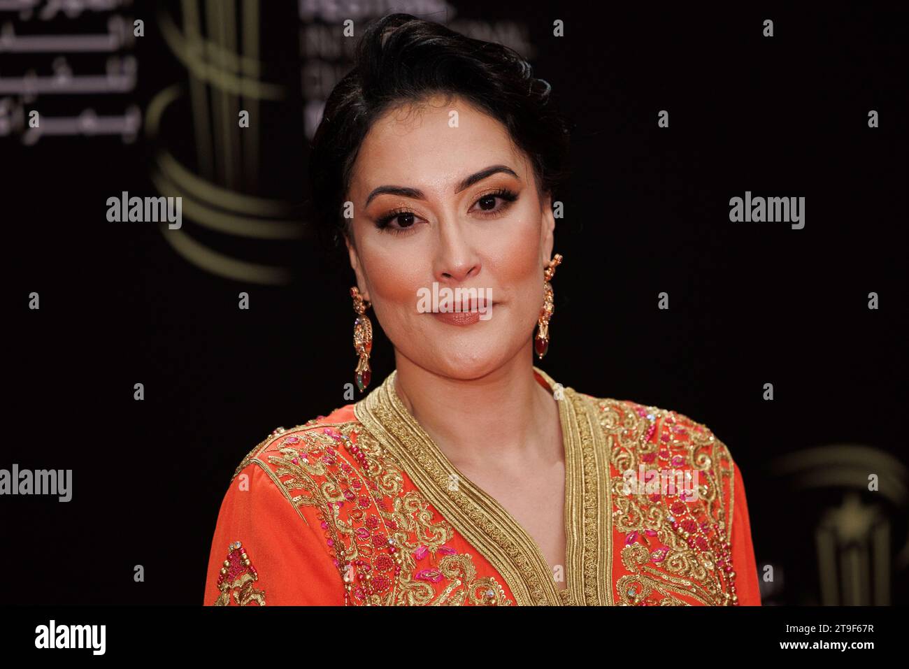 Fatema Zahra Jaouhari poses for photographers before the opening