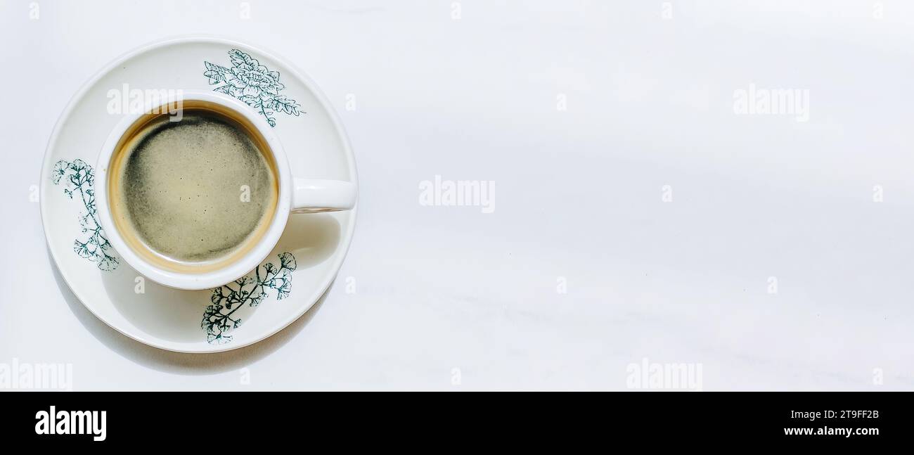 A cup of coffee. Isolated white background. Kopitiam or Malaysian style coffee shop concept. Flat lay or top view. Stock Photo