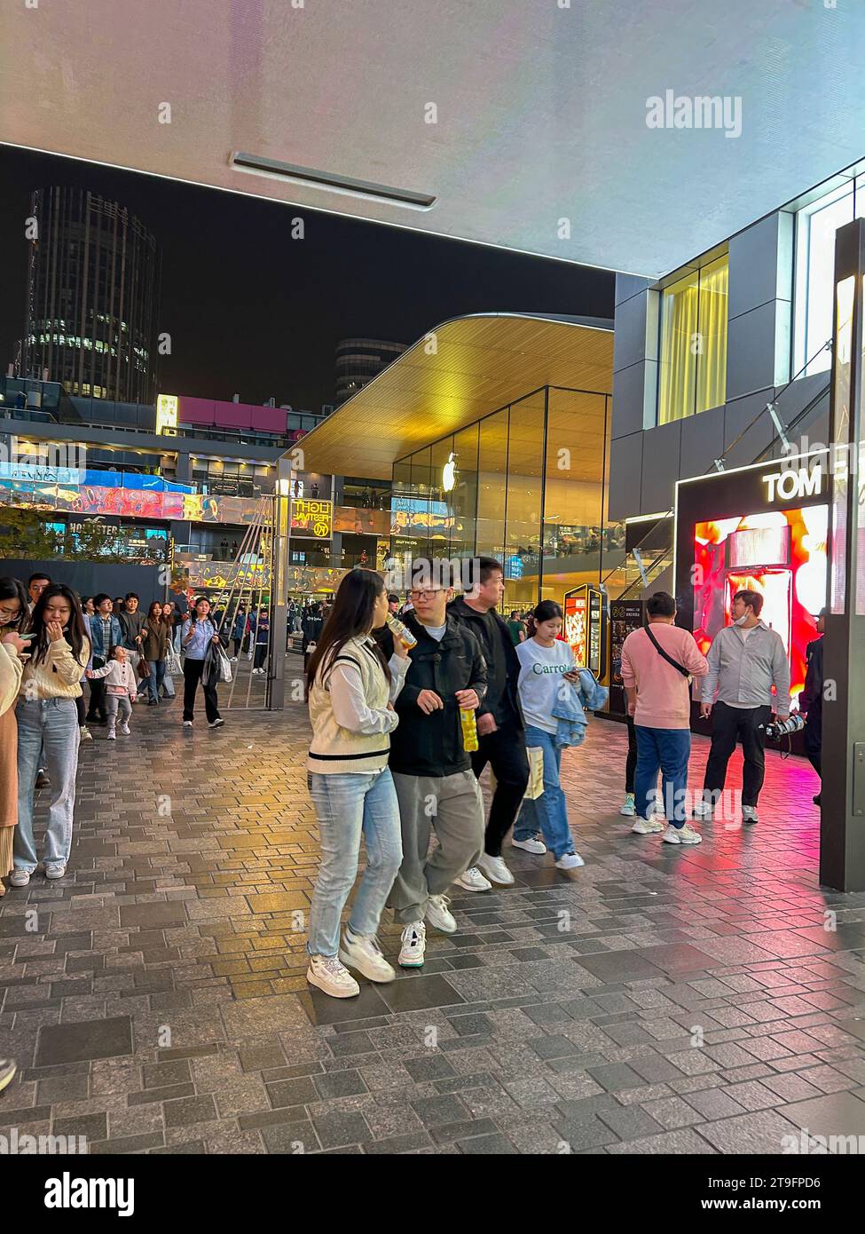 Beijing, China, Large Crowd of people, teenagers shopping, walking , Sanlitun Shopping Center at Night Stock Photo