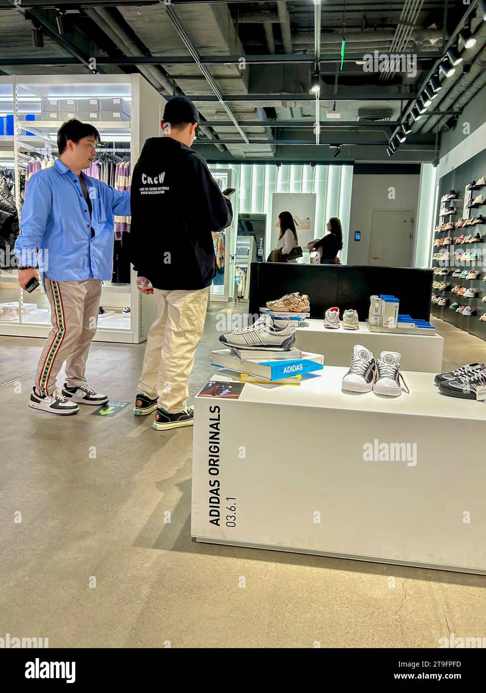 Beijing, China, Small Group Young People, Shopping inside Adidas Sport Clothing Store, Wangfujing St., Center City Stock Photo