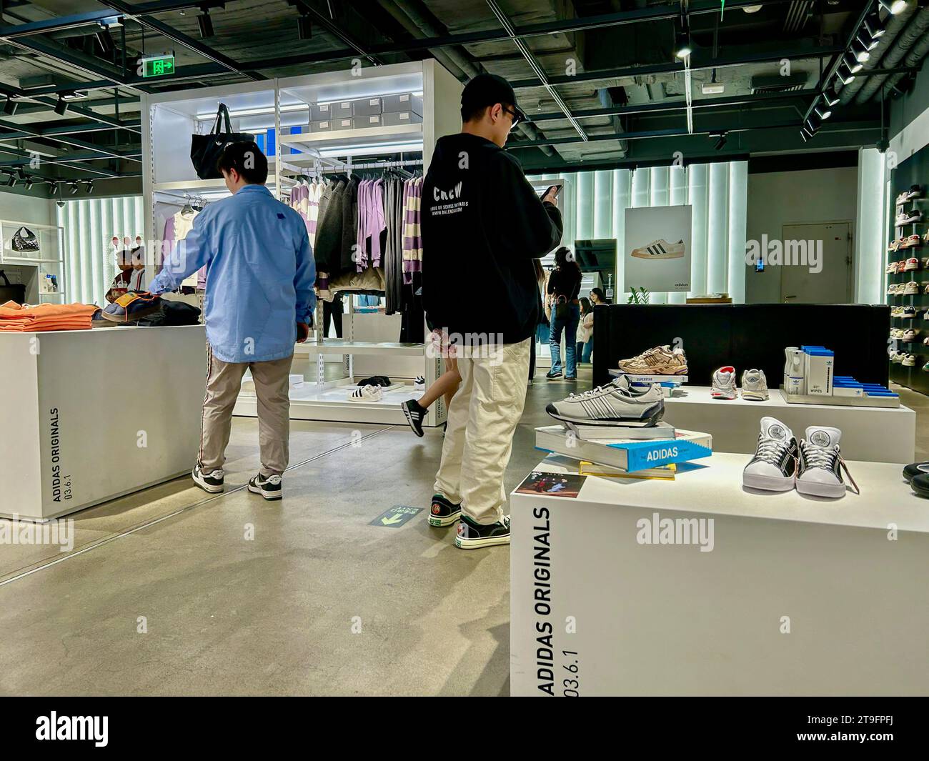 Beijing, China, Wide Angle View, Small Group Young People, shopping asia choices inside Adidas Sneakers, Sport Clothing Store, Wangfujing St., Center Stock Photo