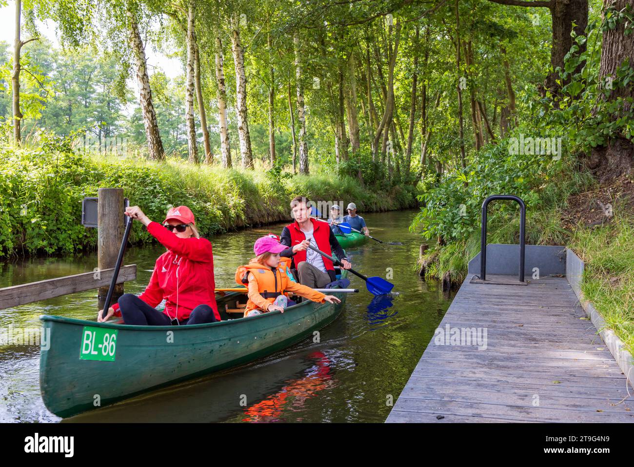 Burg, Germany - July 22, 2023: Passing sluice during canoe trip in Spreewald Venice of Germany with lots of canals and water pleasure between Dresden and Berlin in Brandenburg state in Germany Stock Photo