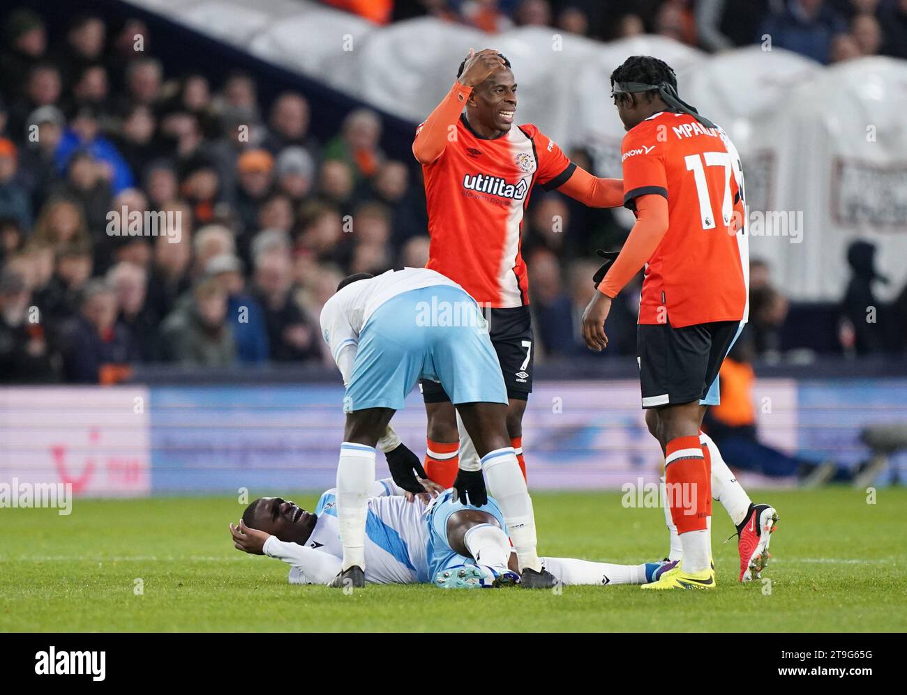 Crystal Palace's Cheick Doucoure lies in pain after picking up an ...