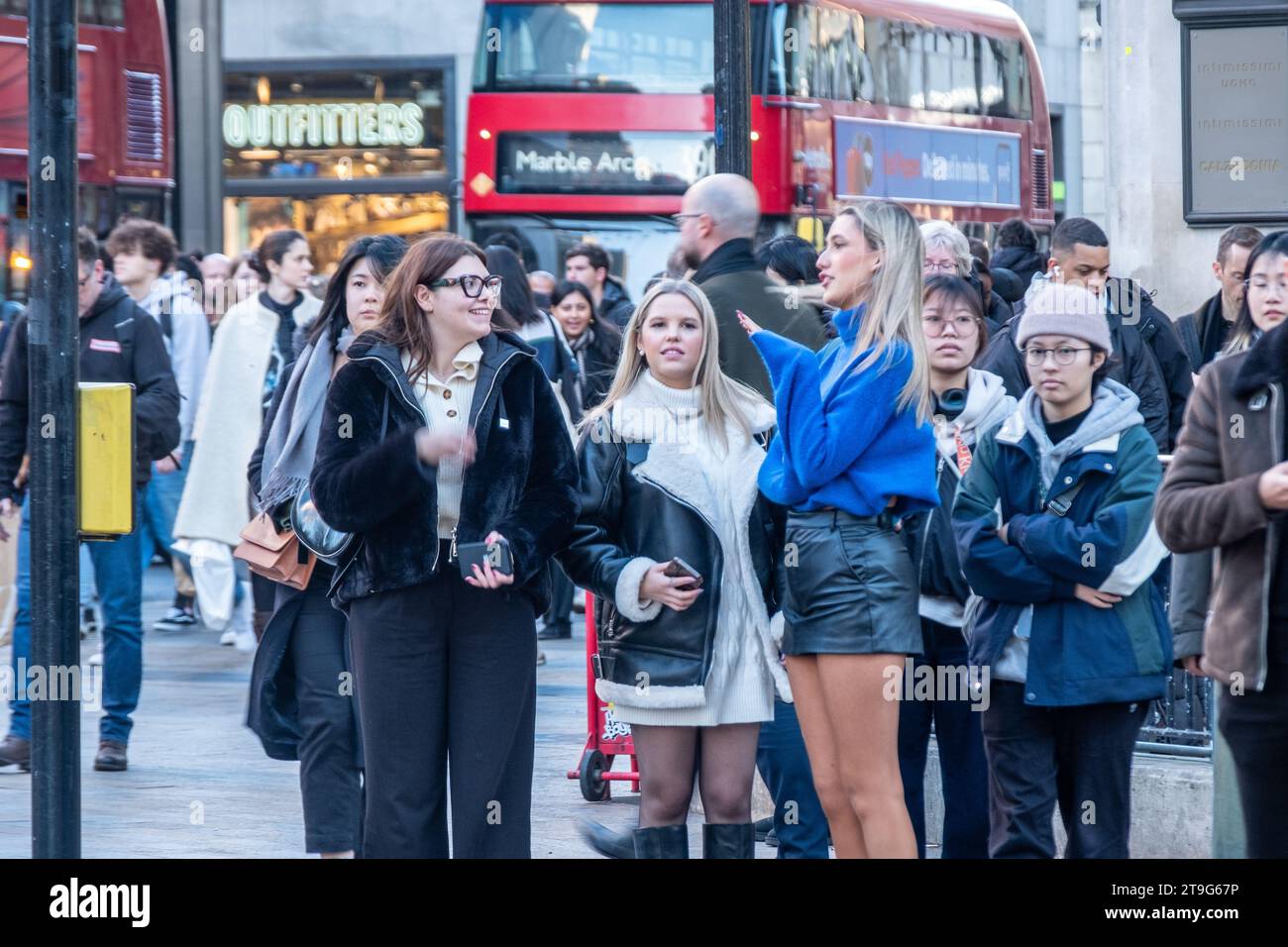 LONDON- NOVEMBER 23, 2023: Female shoppers on Oxford Street in the build up tot he Christmas shopping season Stock Photo