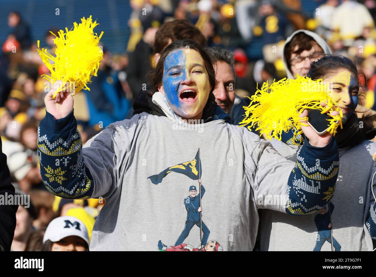 Ann Arbor, United States. 25th Nov, 2023. A Michigan Wolverines fan cheers prior to a game against the Ohio State University in Ann Arbor, Michigan on Saturday, November 25, 2023. Photo by Aaron Josefczyk/UPI Credit: UPI/Alamy Live News Stock Photo