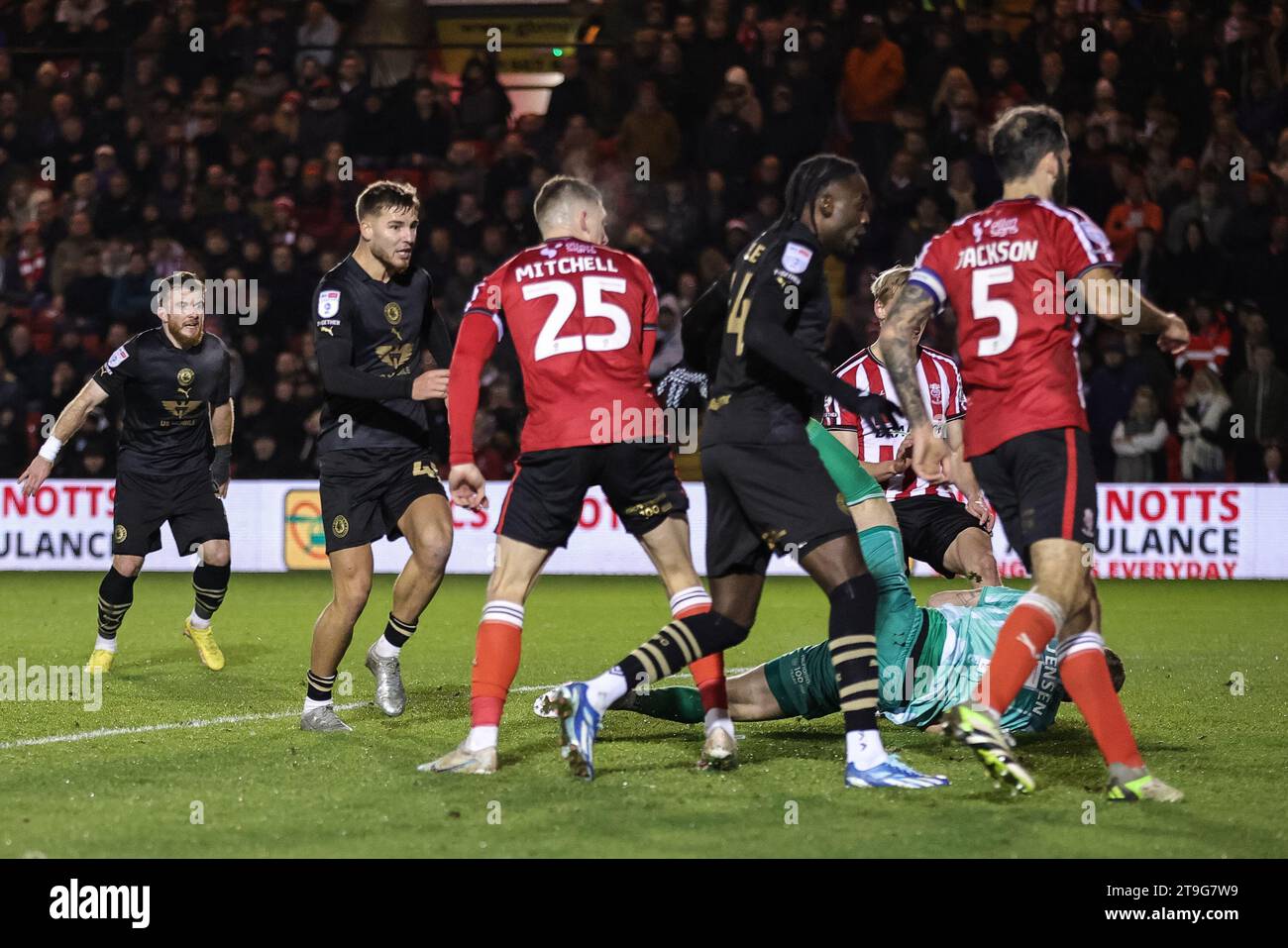 Lincoln, UK. 25th Nov, 2023. John Mcatee #45 of Barnsley scores to make it 1-2 during the Sky Bet League 1 match Lincoln City vs Barnsley at Gelder Group Sincil Bank Stadium, Lincoln, United Kingdom, 25th November 2023 (Photo by Mark Cosgrove/News Images) in Lincoln, United Kingdom on 11/25/2023. (Photo by Mark Cosgrove/News Images/Sipa USA) Credit: Sipa USA/Alamy Live News Stock Photo