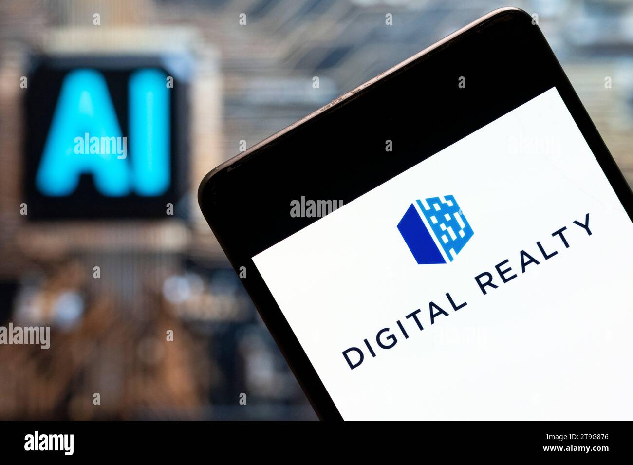 China. 3rd Nov, 2023. In this photo illustration, the real estate investment trust company Digital Realty (NYSE: DLR) logo seen displayed on a smartphone with an Artificial intelligence (AI) chip and symbol in the background. (Credit Image: © Budrul Chukrut/SOPA Images via ZUMA Press Wire) EDITORIAL USAGE ONLY! Not for Commercial USAGE! Stock Photo