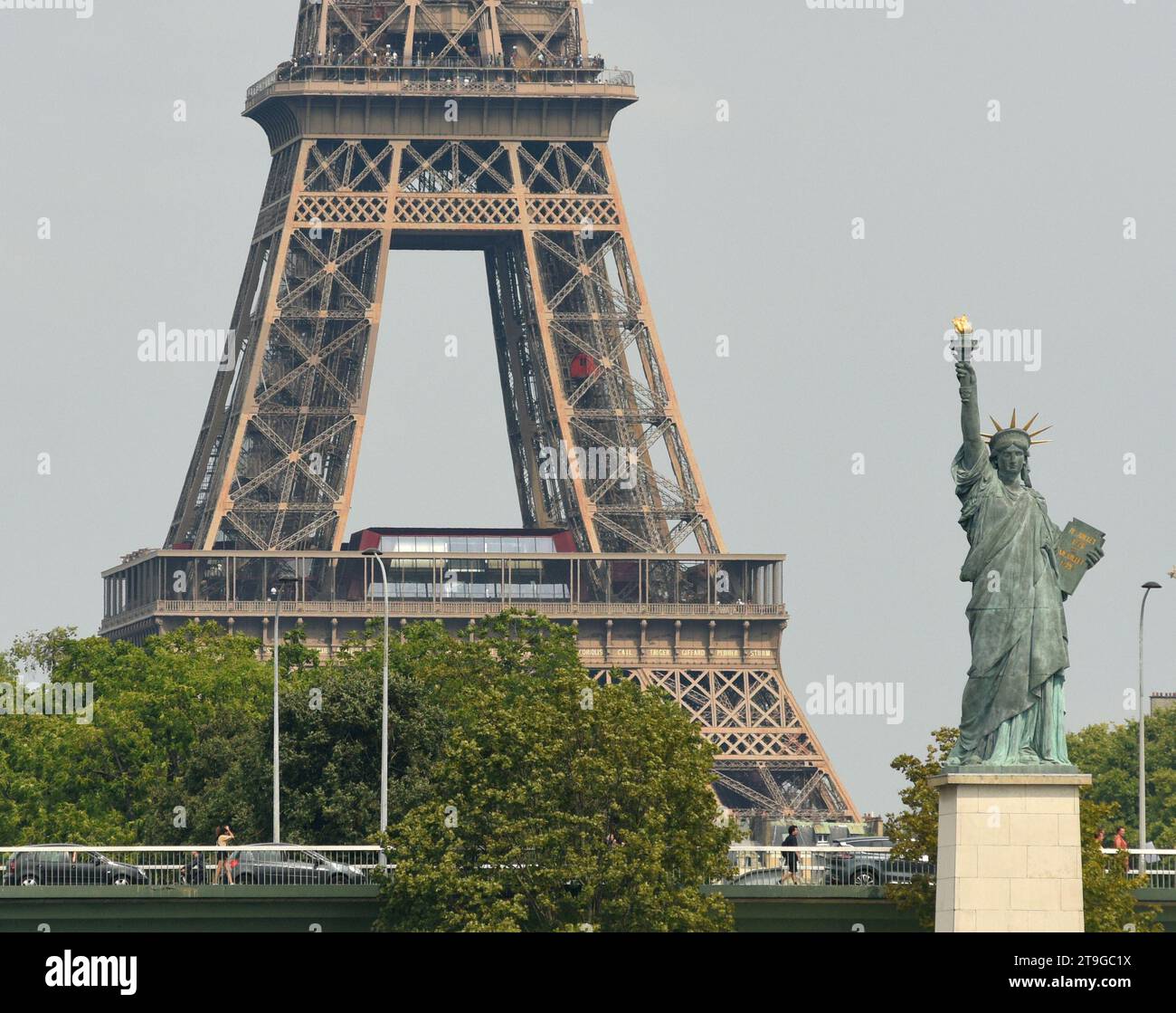 Paris, France - August 28, 2019: Statue of Liberty in Paris and Eiffel Tower at the background. Stock Photo