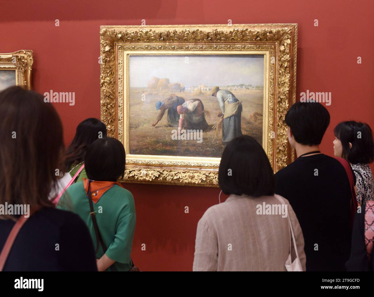 Paris, France - August 29, 2019: Visitors near the Gleaners (Des glaneuses)1857 by Jean-François Millet painting in Museum d'Orsay in Paris, France. Stock Photo