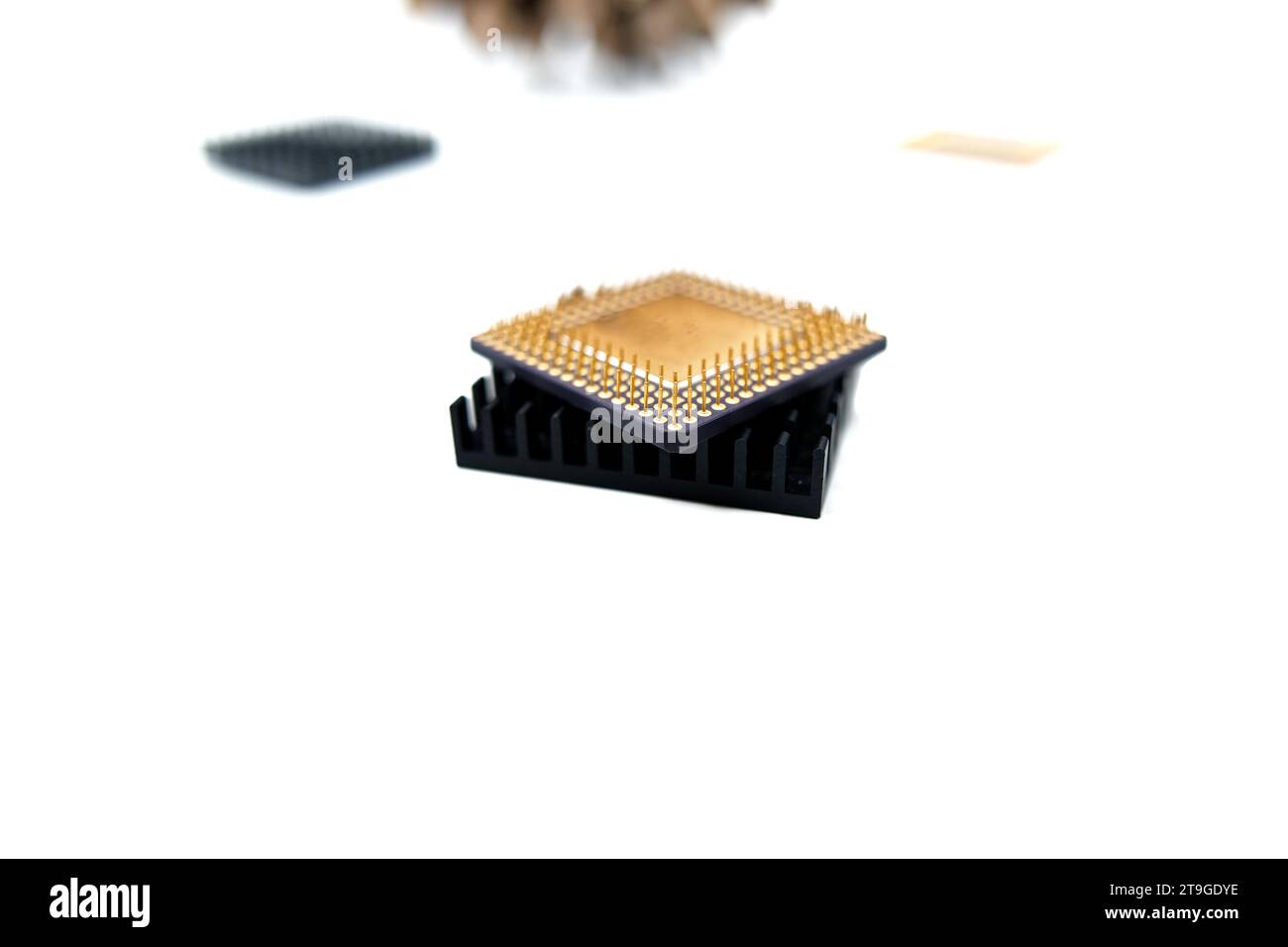 Microprocessor with a heat sink lying on a white surface, isolated on white Stock Photo