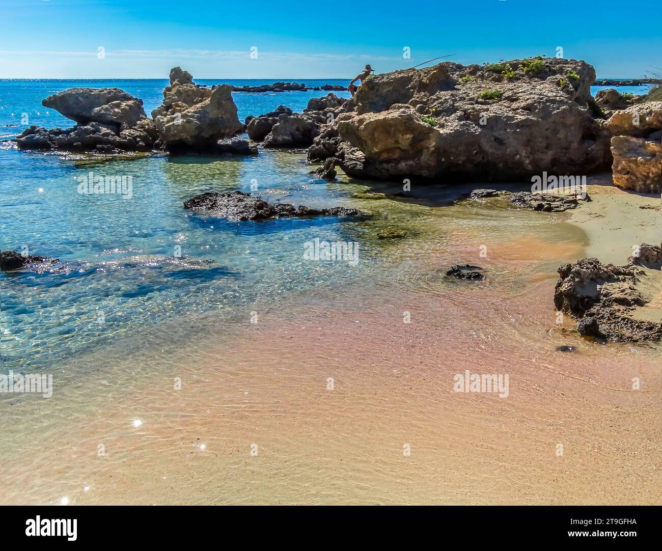 Looking along the shore at Elafonissi beach, Crete the famous pink ...