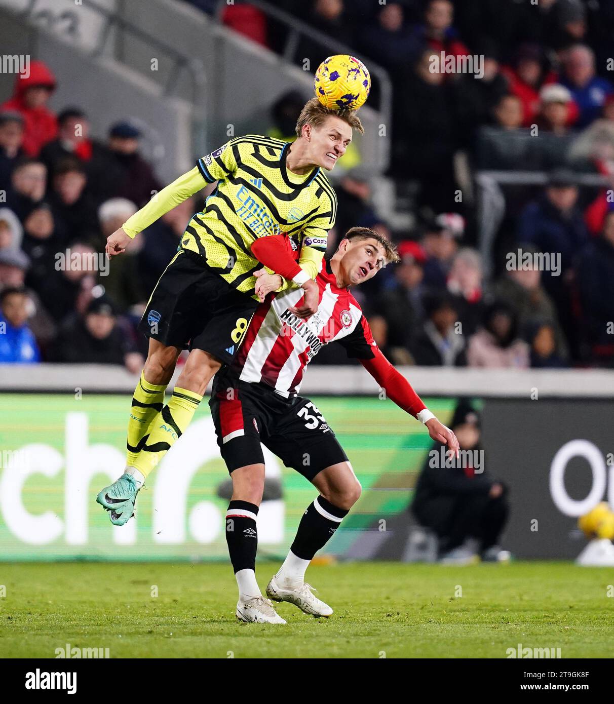 Arsenal's Martin Odegaard and Brentford's Yehor Yarmolyuk (right) battle for the ball during the Premier League match at Gtech Community Stadium, London. Picture date: Saturday November 25, 2023. Stock Photo