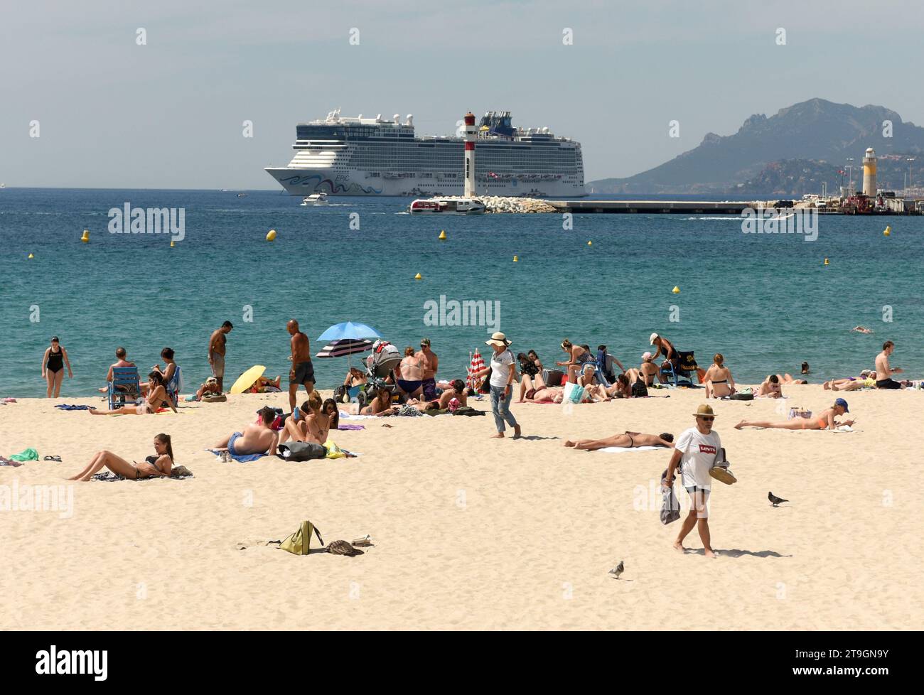 Cannes, France - June 21, 2019: People rest on the beach of the Cannes. Stock Photo