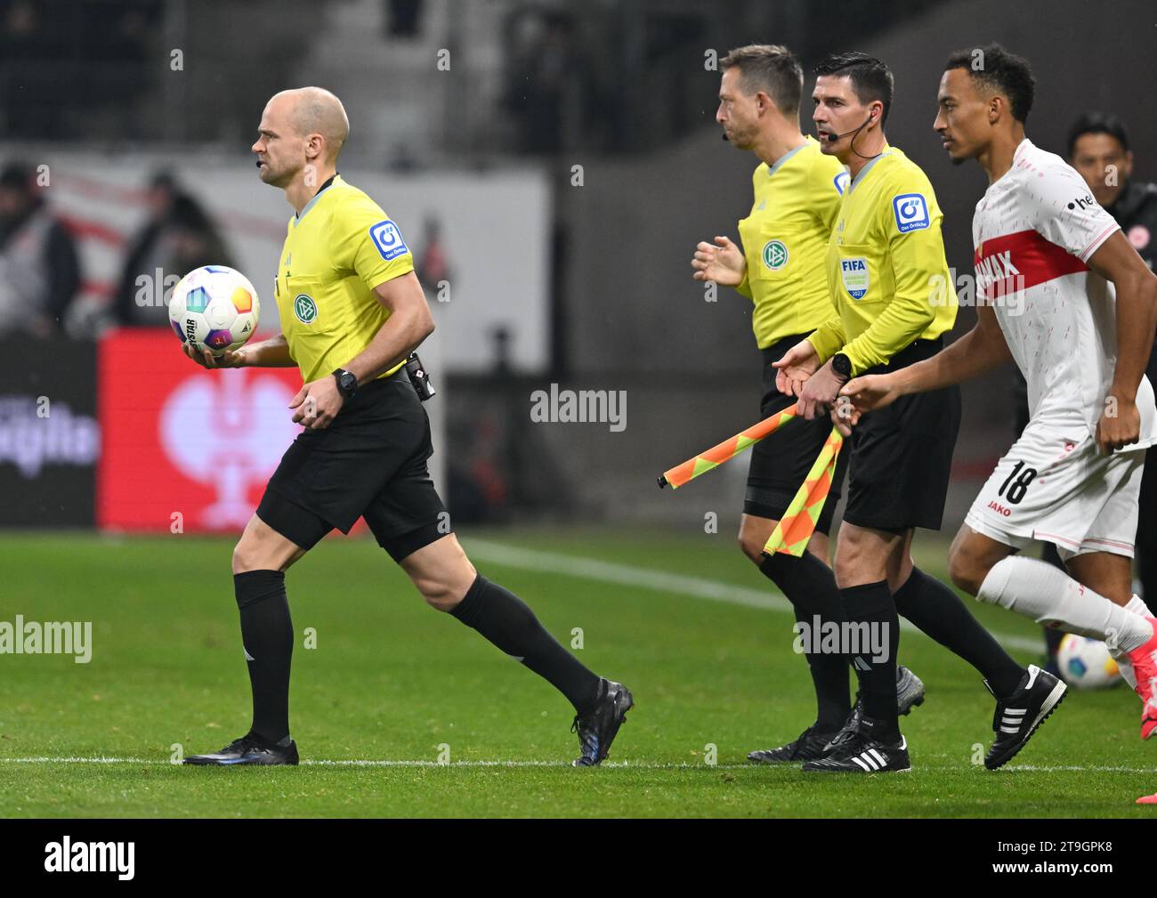 25 November 2023, Hesse, Frankfurt/Main: Soccer: Bundesliga, Eintracht Frankfurt - VfB Stuttgart, matchday 12, at Deutsche Bank Park. Referees Patrick Schwengers (l-r), Mark Borsch and Stefan Lupp come onto the pitch after the half-time break and Felix Brych's injury. Photo: Arne Dedert/dpa - IMPORTANT NOTE: In accordance with the regulations of the DFL German Football League and the DFB German Football Association, it is prohibited to utilize or have utilized photographs taken in the stadium and/or of the match in the form of sequential images and/or video-like photo series. Stock Photo